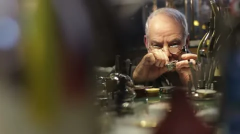 Watchmaker examines old  watch Stock Footage 21440837