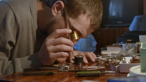 Watchmaker repairing clockwork Stock Footage 72744602