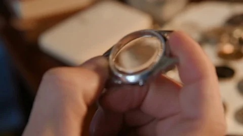 Watchmaker repairing clockwork Stock Footage 72746046