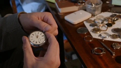 Watchmaker repairing clockwork Stock Footage 72746325