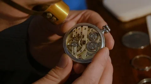 Watchmaker repairing clockwork Stock Footage 72746483