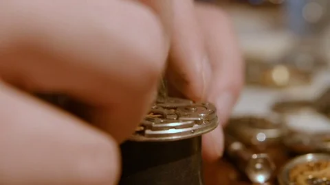 Watchmaker repairing clockwork Stock Footage 72747199