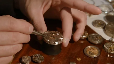 Watchmaker repairing clockwork Stock Footage 79603632