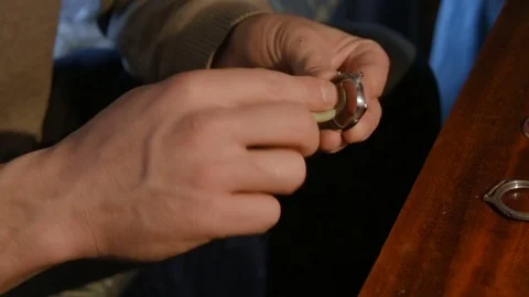 Watchmaker repairing clockwork Stock Footage 79603694