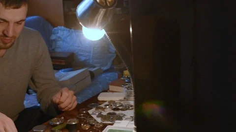 Watchmaker repairing clockwork Stock Footage 79603797