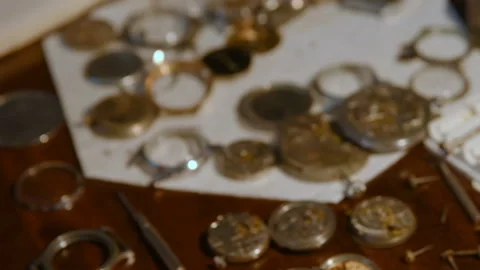 Watchmaker repairing clockwork Stock Footage 100519651