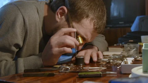 Watchmaker repairing clockwork Stock-Footage 101440075
