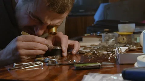 Watchmaker repairing clockwork Stock-Footage 101440136