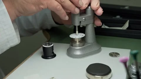 Watchmaker using special tools to assemble a watch. Stock Footage 167573608
