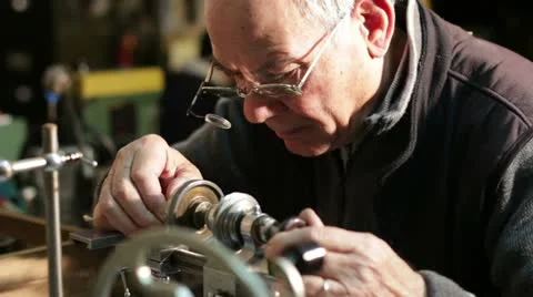 Watchmaker working with a antique lathe 스톡 동영상 21440354