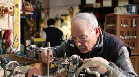 Watchmaker working with a antique lathe Video stock 21440983