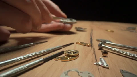 Watchmaker's workshop, watchmaker is repairing mechanical watches Stock Footage 146011734
