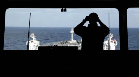 Watchman observing around by binocular. Stock-Footage 64298272