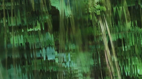 Water 0001. Flat waterfall forms a distorted glass effect.  4K Locked Tripod. Stock Footage 137102177