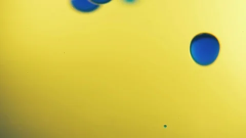 Water abstract background. Blue round drops of water smoothly settle in a yellow 動画素材 88467715