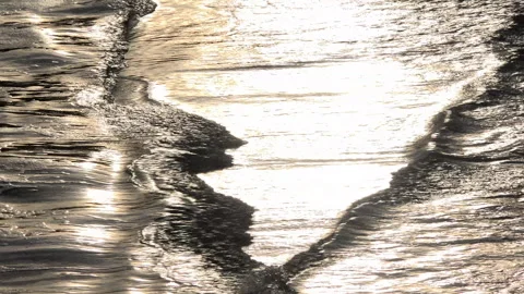 Water abstract background waves on shore gold pattern UK 4K Video stock 292739886