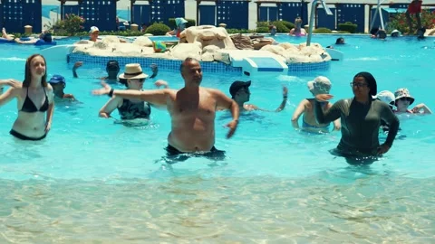 Water aerobics classes in the Gravity Aqua park Hotel pool. Stock Footage 341274333