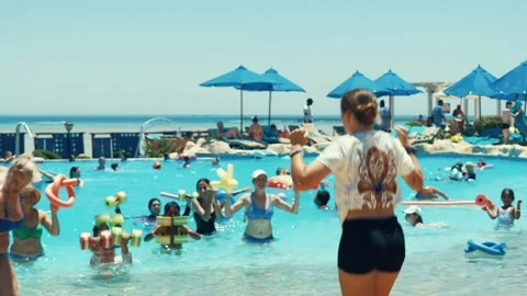 Water aerobics classes in the Gravity Aqua park Hotel pool. Stock Footage 341274546
