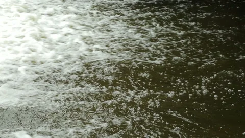 The water after the waterfall flows into the river Stock Footage 138641352