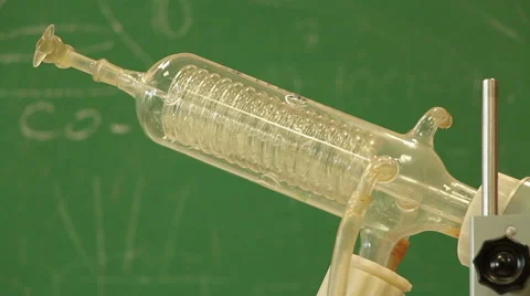 Water and gas  bubbles circulating in glass spiral tube on a green background Stock Footage 53543012