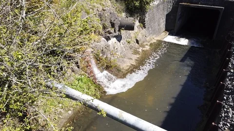 Water And Pipe Into A Stream Stock Footage 126744323