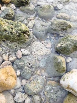 Water and stones Stock Photos
