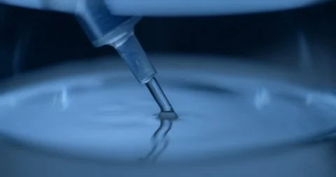 Water and syringe slow motion Stock Footage 93275563