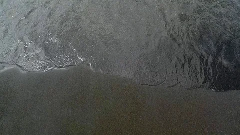 Water and waves on a beach with black sand on vulcano island Stock-Footage 80163757