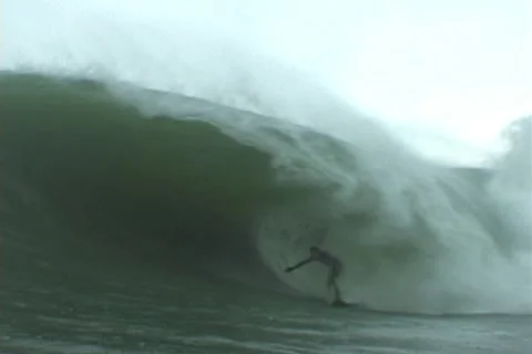 Water angle of Surfer riding big wave Stock Footage 10682860