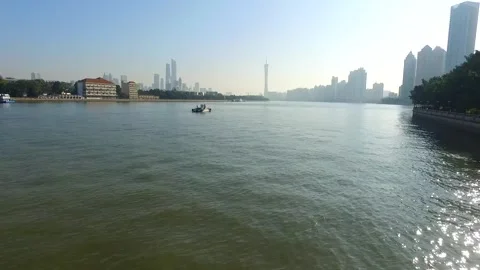 The water area and surrounding buildings near the Guangzhou Tower. Video stock 249243383