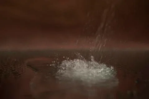 Water from the atomizer pours down, onto the mirror. Splash, drops. Stock Photos