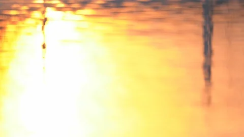 Water backgroun surface motion from sunset in pond background, golden wave Stock Footage 125439148