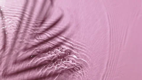 Water background. Pink aqua texture, surface of ripples, rings, transparent Stock Footage 168679266