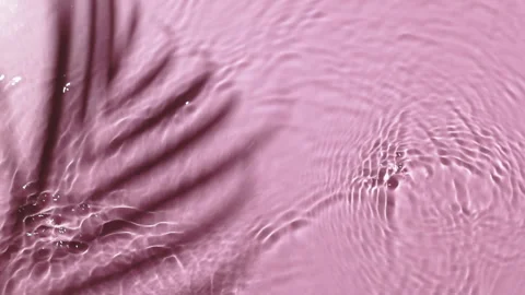 Water background. Pink aqua texture, surface of ripples, rings, transparent Stock Footage 168679471