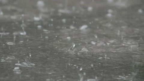Water Background raindrops make small bubbles in puddles, Stock Footage 137778881