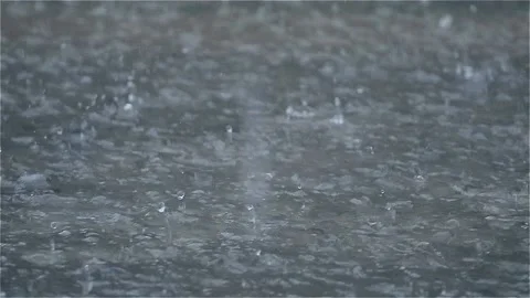 Water Background raindrops make small bubbles in puddles, Stock Footage 140980279
