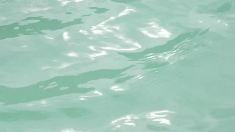 Water background. Ripples and water surfaces in the swimming pool. Stock Footage 207685035