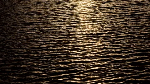 Water background, sea waves at sunset, the play of ripples Stock Footage 243674081