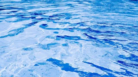 Water background texture. Blue wave pool surface. Summer sea abstract pattern Stock Photos