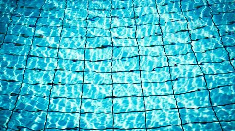 Water background texture. Blue wave pool surface. Summer sea abstract pattern Stock Photos