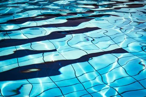 Water background texture. Blue wave pool surface. Summer sea abstract pattern Stock Photos