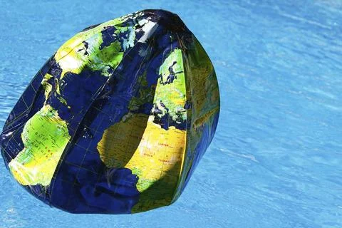Water ball as a globe. The globe is running out of air due to environmental Stock Photos