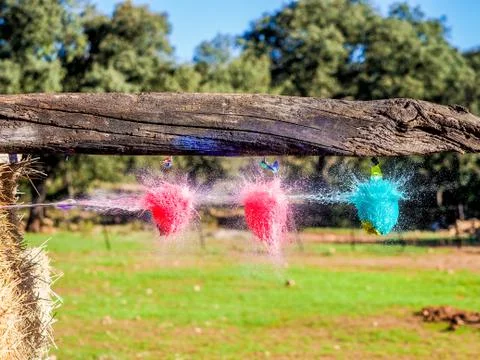 Water balloon explosion when hit by an arrow Stock Photos