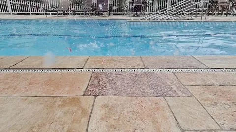 Water balloon falling on the edge of the pool and exploding with original s.. Stock Footage 332313324