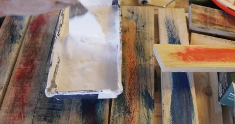 Water based Acrylic paint diluted in plastic pot Stock Footage 328988995