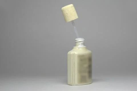 Water-based white text correction fluid in plastic ribbed bottle. applicato.. Stock Photos