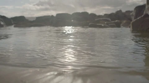 Water on the beach at sunrise Stock Footage 74070084