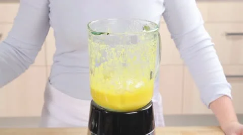 Water being added to a mango lassi 스톡 동영상 24657351