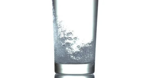 Water being poured into Glass against White Background, Slow Motion 4K Stock Footage