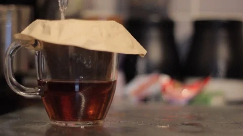 Water Being Poured Through a Coffee Filter Stock Footage 85993948